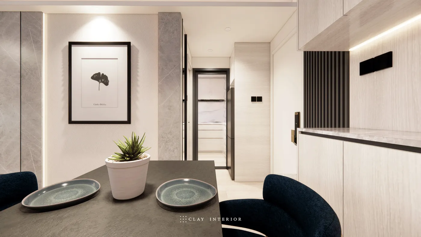 Dining area and entrance corridor, with a black dining table and deep-blue velvet chairs