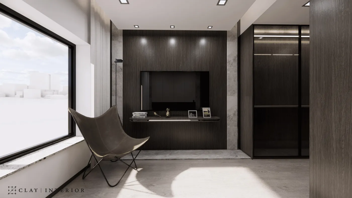 Master bedroom TV wall in dark timber slats, with a butterfly chair and glass-fronted wardrobe