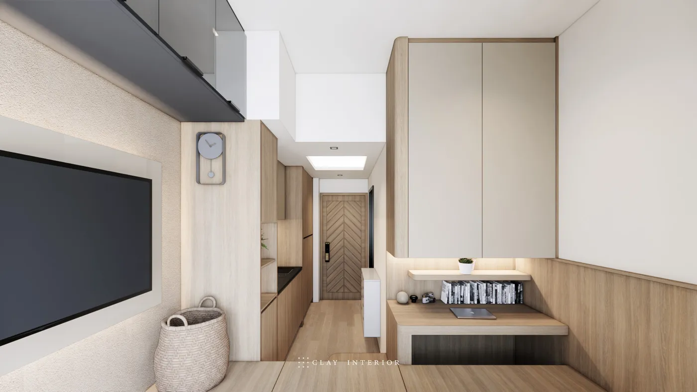 客廳望向玄關大門，木地台書枱配頂天儲物櫃