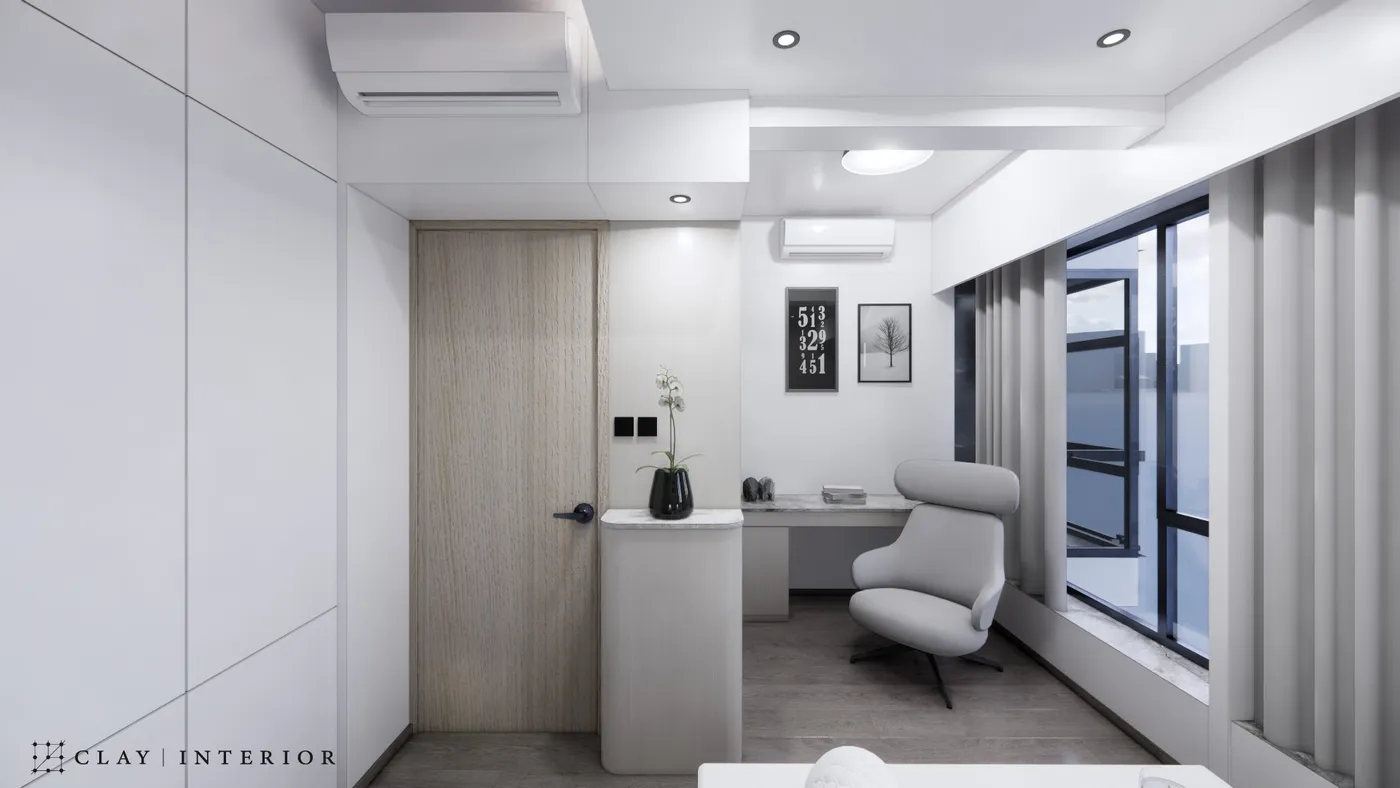 Study corner with a window-side desk, a lounge chair, and a curved storage cabinet