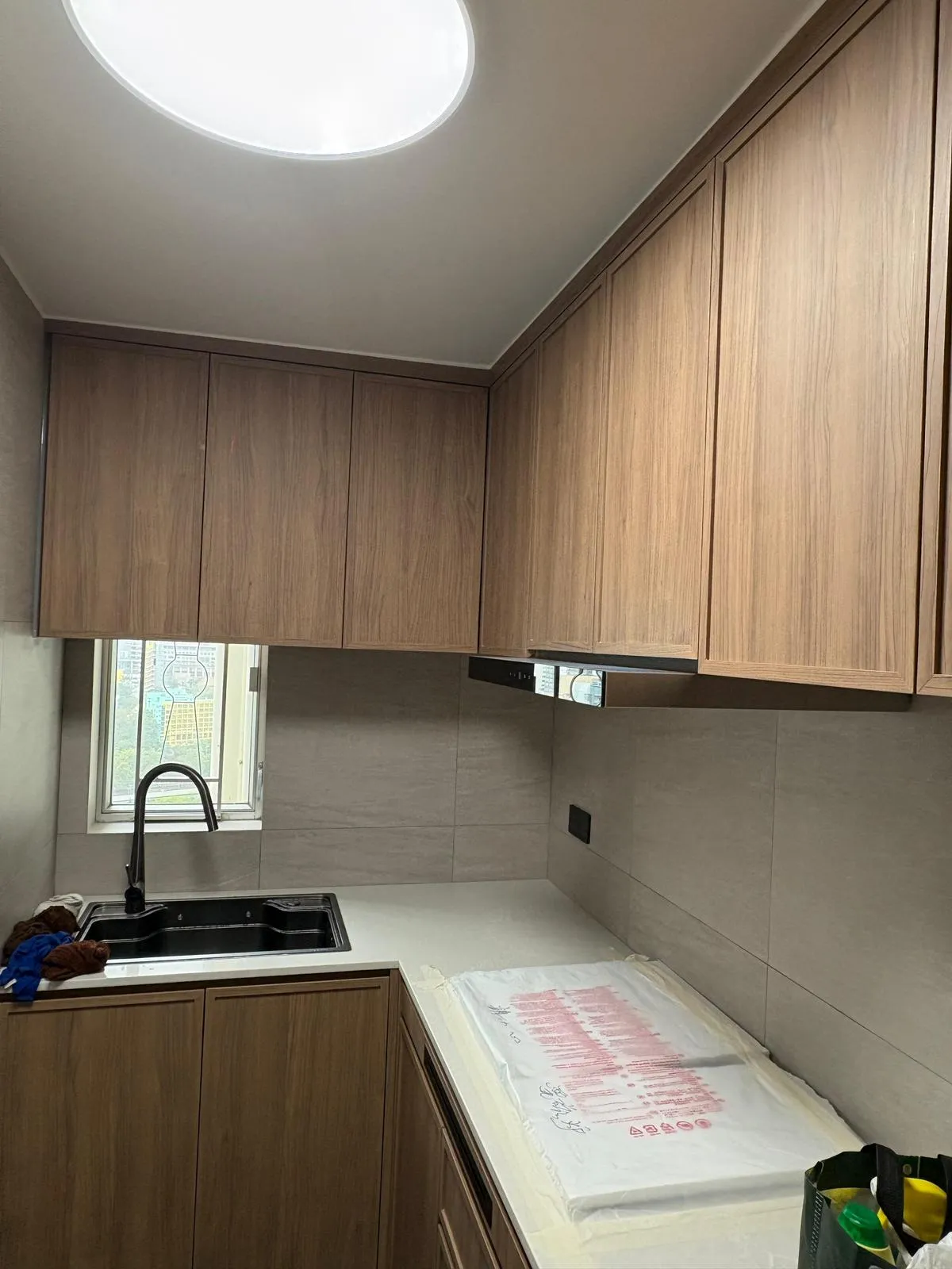 Kitchen island with overhead cabinets