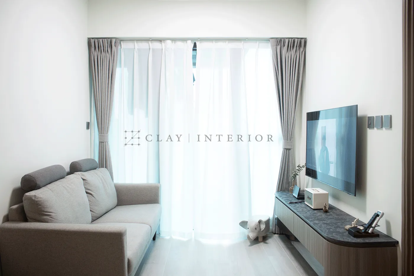 Living room sofa and TV wall, floor-to-ceiling curtains paired with wood flooring