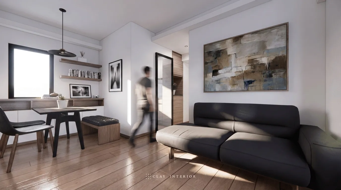 Living and dining corner with an artwork feature wall and black sofa