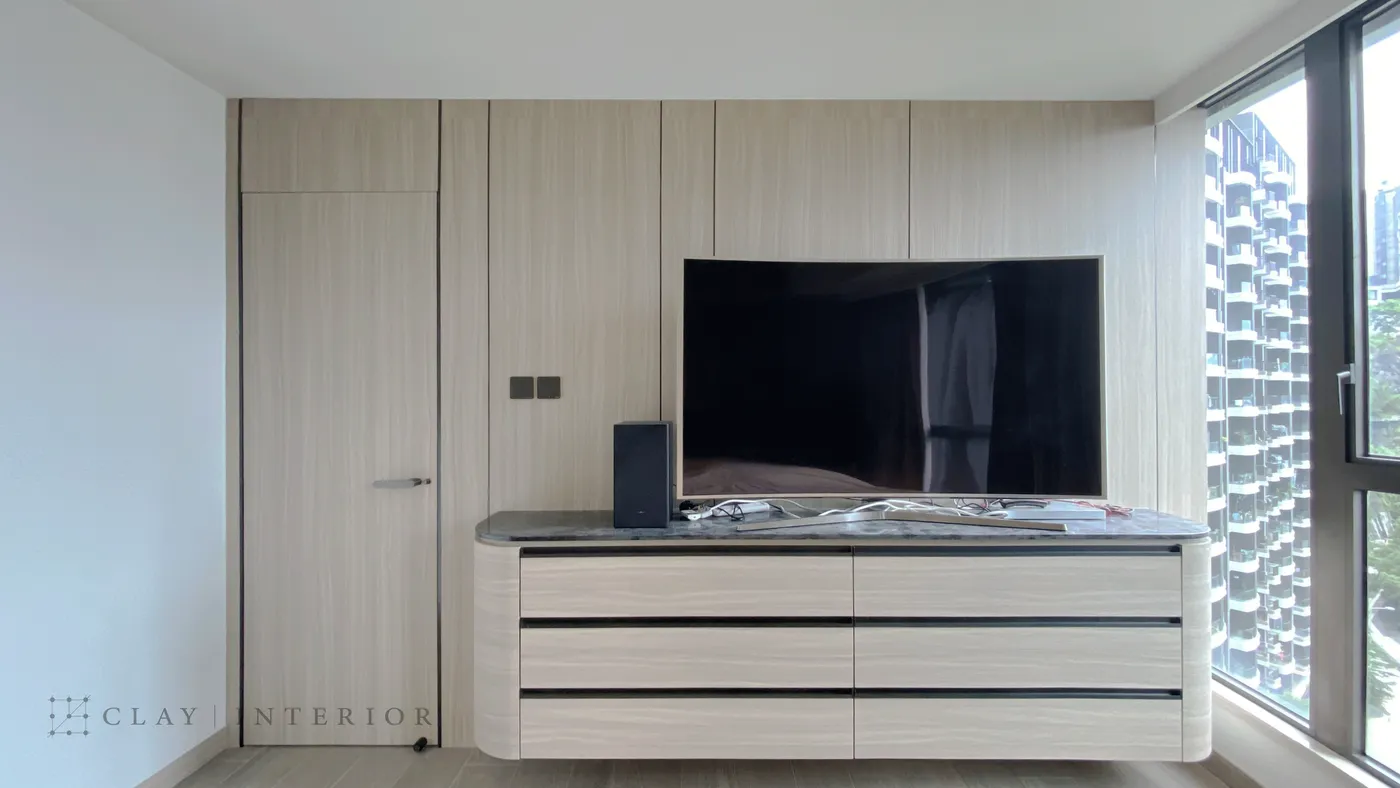 Bedroom TV feature wall with a built-in wood-finish storage unit
