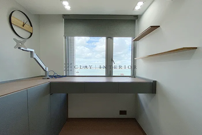 Study work corner with custom desk and shelving, enjoying views through the window
