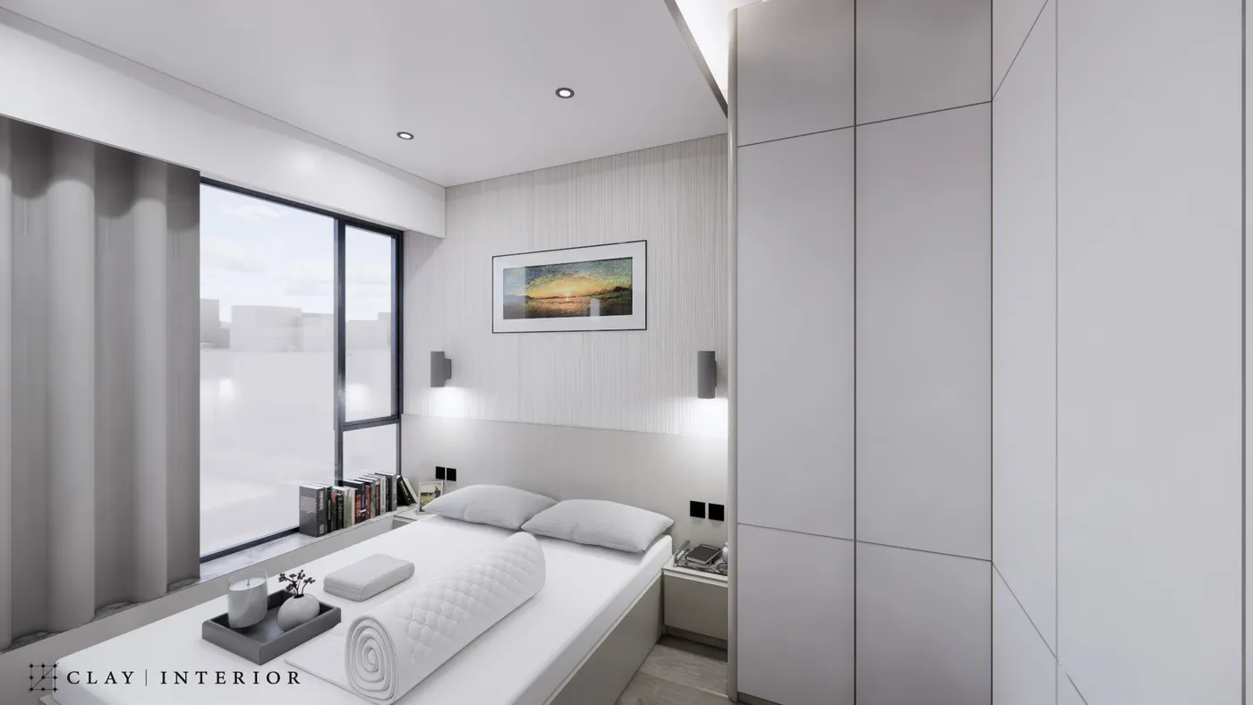 Bedroom with a bed, tall pale-grey wardrobe, and wall lights above the headboard with a framed artwork